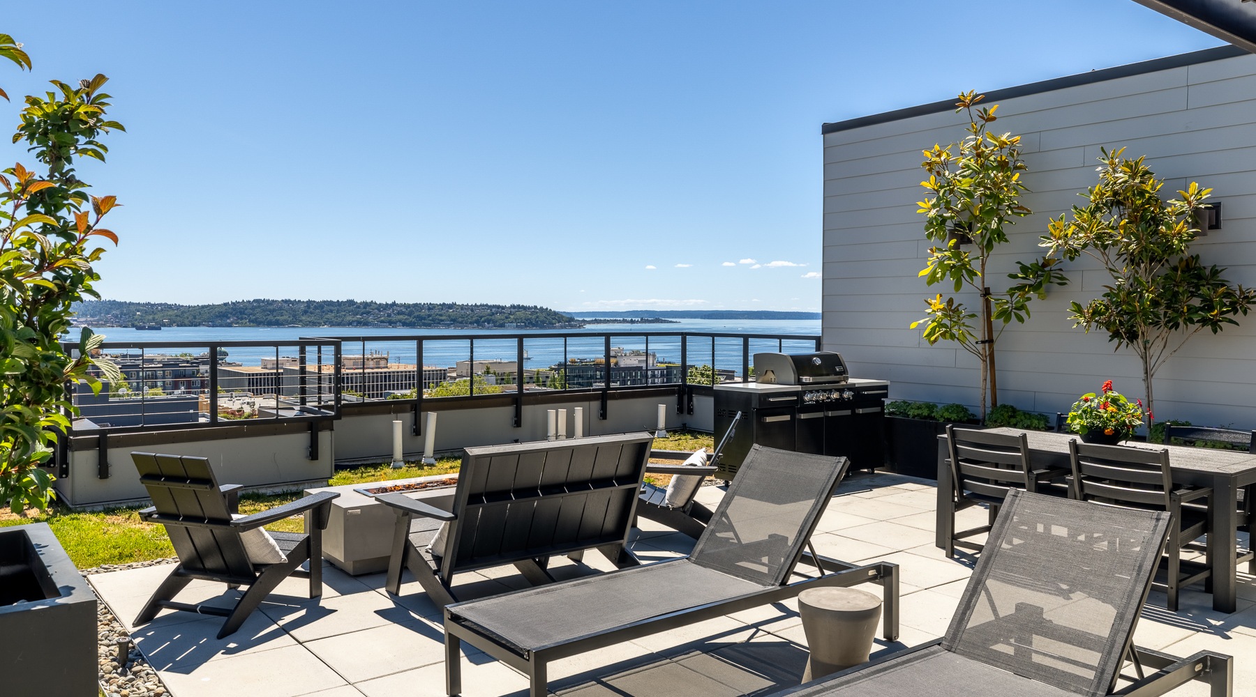 Chairs in from of firepit with Seattle views in background